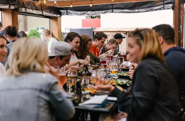 Guests gathered around a lively restaurant event table