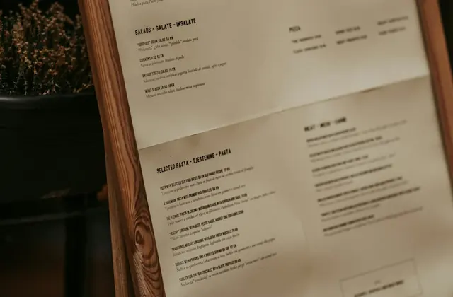 A restaurant menu with multiple language sections